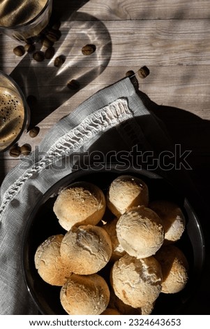 Brazilian traditional food pao de queijo (cheese balls) served with cup of coffee