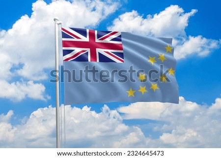 Tuvalu national flag waving in the wind on clouds sky. High quality fabric. International relations concept