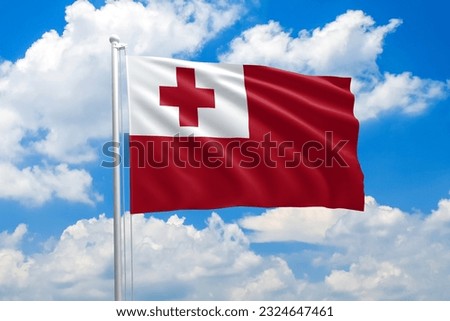 Tonga national flag waving in the wind on clouds sky. High quality fabric. International relations concept