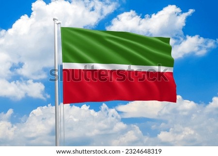 Tatarstan national flag waving in the wind on clouds sky. High quality fabric. International relations concept