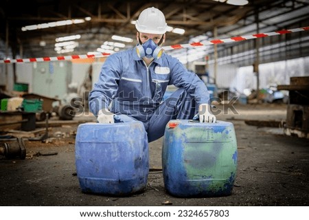 Chemical leak and safety first concept. Man wearing a Toxic protective mask in factory. Biohazard. Engineer man with gas mask with danger chemical in construction or factory or garbage industry area.