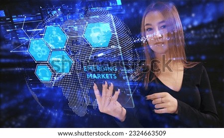 Business, Technology, Internet and network concept. Young businessman working on a virtual screen of the future and sees the inscription: Emerging markets Royalty-Free Stock Photo #2324663509