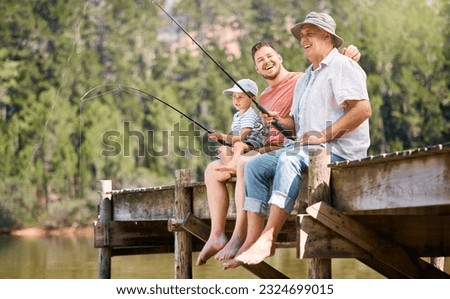 Happy father, grandfather and child fishing at lake together for fun bonding or peaceful time in nature. Dad, grandpa and kid enjoying life, catch or fish with rod by water pond or river in forest