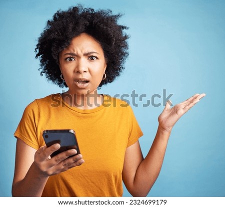 Confused, phone and woman portrait isolated on blue background for college doubt, decision or questions. Stress, surprise and young person or student in what or why hand for mobile problem or choice Royalty-Free Stock Photo #2324699179