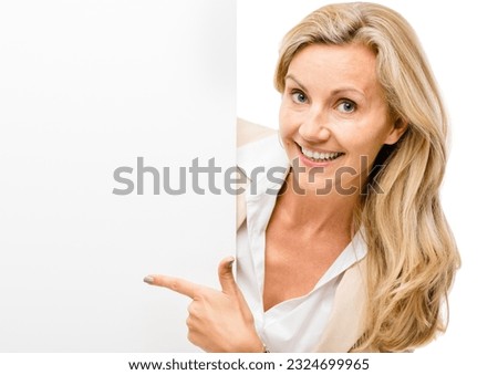 Happy woman, portrait and pointing to billboard on mockup space for advertising isolated on a white studio background. Female person or employee with paper, sign or poster for banner or advertisement