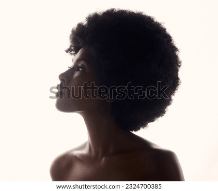 Hair, silhouette and profile of black woman with afro hairstyle, beauty and skincare on white background. Natural haircare, cosmetics and beautiful face of African model with glow and shine in studio