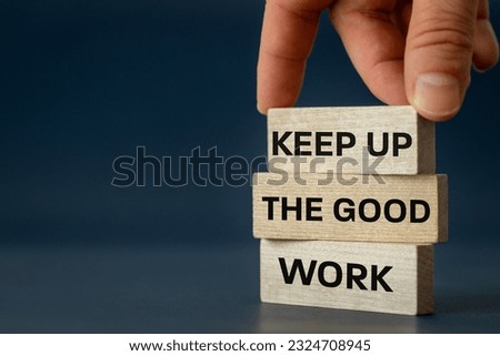 Keep up the good work, text is written on wooden blocks, Business concept, Motivating slogan, work commitment, copy space

