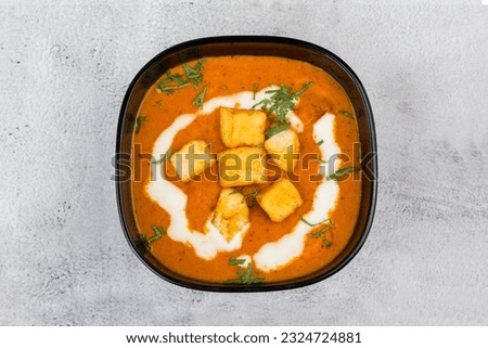 paneer butter masala top view with white back ground Royalty-Free Stock Photo #2324724881