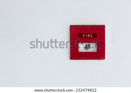 Old red box fire alarm  on wall