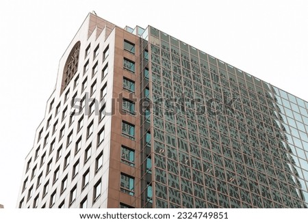 modern building in the heart of the financial district, symbolizing progress and prosperity in the commercial real estate industry. Its large windows represent transparency and sleek design
