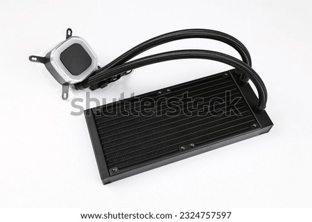 A Computer Cooler with a Black Radiator isolated on a white background, this is a Desktop CPU cooler unit. This hardware part is used to assemble PC.