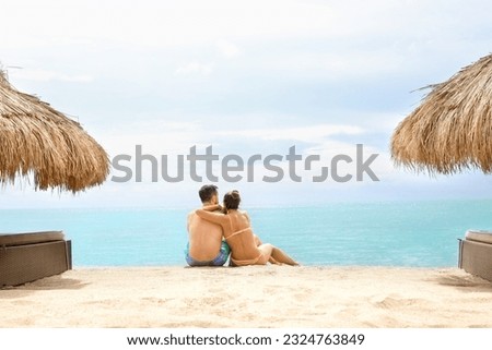 Couple on the beach enjoying the water