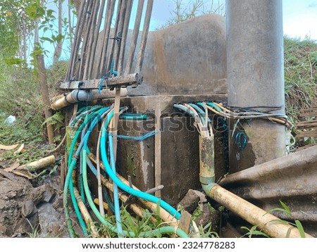 many water hoses to distribute water to the homes of villagers without electricity