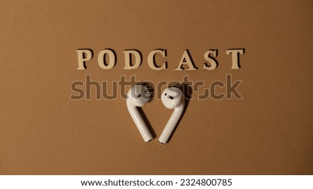 Announcement text PODCAST on beige background with wireless headphones. Podcasting concept. Listening radio audio healing wellness sound