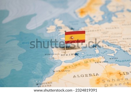 The Flag of Spain on the World Map. Royalty-Free Stock Photo #2324819391