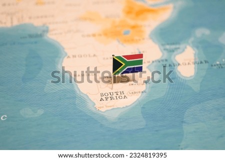 The Flag of South Africa on the World Map. Royalty-Free Stock Photo #2324819395