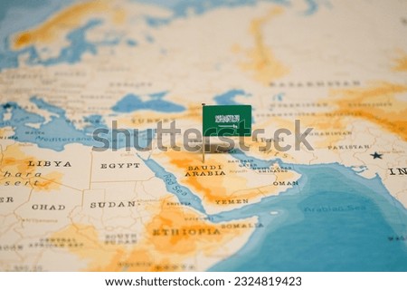 The Flag of Saudi Arabia on the World Map. Royalty-Free Stock Photo #2324819423