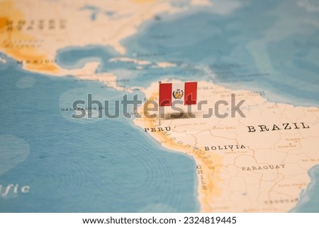 The Flag of Peru on the World Map. Royalty-Free Stock Photo #2324819445