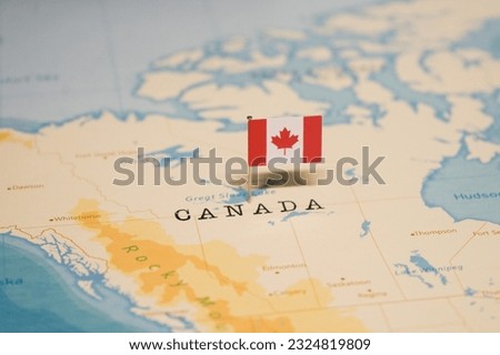 The Flag of Canada on the World Map. Royalty-Free Stock Photo #2324819809