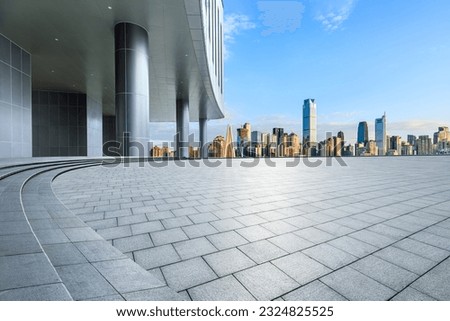 City square and skyline with modern buildings in Chongqing, China.