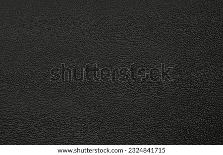 black artificial leather with waves and folds on PVC base Royalty-Free Stock Photo #2324841715