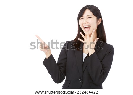 surprised Japanese businesswoman pointing side