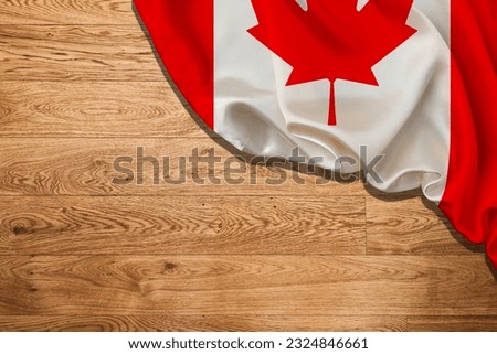 Canada flag on black wood wall. Horizontal panoramic banner. Victoria Day, Canada Day.