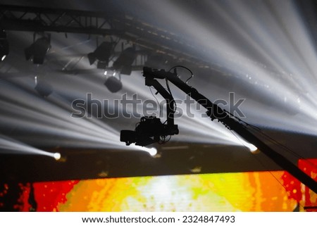 Video camera mounted on a crane to use for taking high-angle shots in concerts