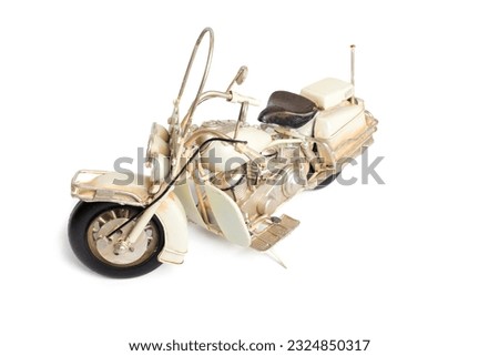 souvenir vintage toy motorcycle on a white background. Iron motorcycle.