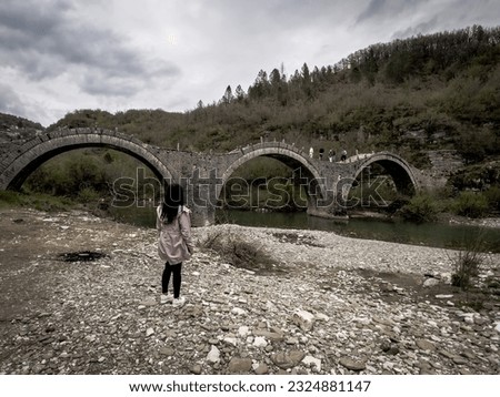 View of the traditional stone Kalogeriko or Plakida Bridge in Zagori of Epirus, Greece