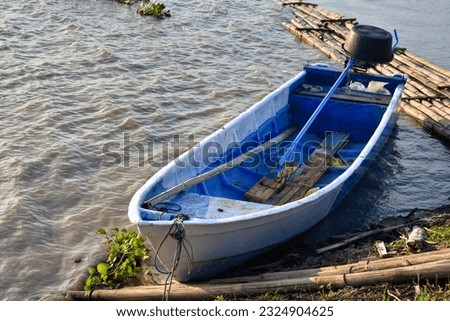 Small fishing boat with fishing net and equipment