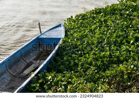 Small fishing boat with fishing net and equipment