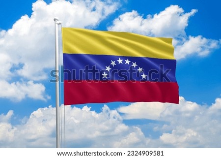 Venezuela national flag waving in the wind on clouds sky. High quality fabric. International relations concept