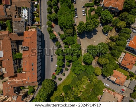 Aerial view of the historic center of Novara, Italy. All houses have traditional red tiled roofs in the old town. Italy, Piedmont.