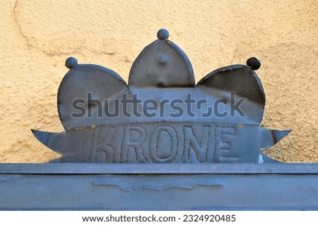 Decorative Metal Plaque over House Doorway with Name 'Krone' 