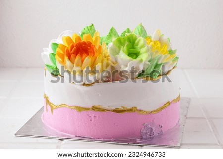 Homemade birthday cake with colorful flower decoration. perfect for recipe, article, or any cooking contents. with copy space. 
