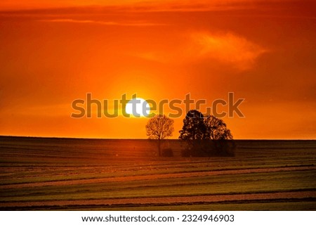 Epic sunset over farmland. Poland.