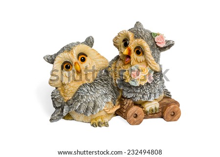 Figurine two lovers owls with flowers isolated on white background