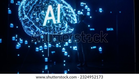 Back View of a Woman Holding Laptop Computer, Standing in Front of Big Digital Screen with AI Neural Network 3D Visualization. Professional Data Scientists Activating Artificial Inteligence System Royalty-Free Stock Photo #2324952173