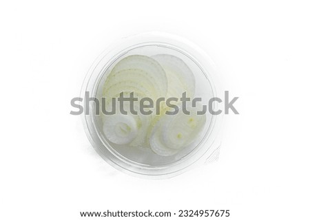 slice white onion in top shot at high res. image and isolated in white with plastic container packaging