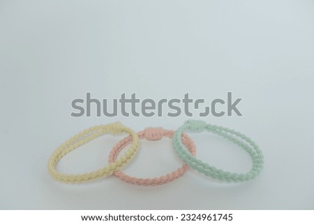Yellow, pink and blue hair band isolated on white background.