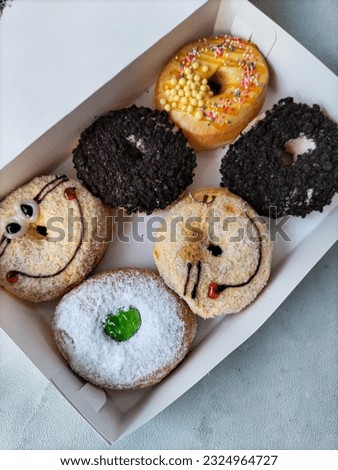 Six donuts with different toppings