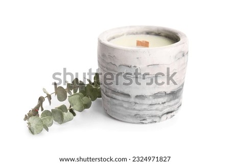 Holder with candle and eucalyptus on white background Royalty-Free Stock Photo #2324971827