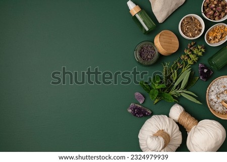 Botanical blends, herbs, essencial oils for naturopathy. Natural remedy, herbal medicine, blends for bath and tea on green background Royalty-Free Stock Photo #2324979939