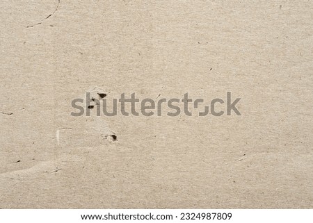 Cardboard texture. Brown cardboard background. Empty carton with surface texture. Brown cardboard sheet of paper