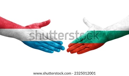 Handshake between Bulgaria and Luxembourg flags painted on hands, isolated transparent image.