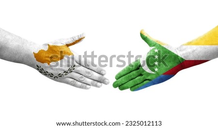 Handshake between Comoros and Cyprus flags painted on hands, isolated transparent image.