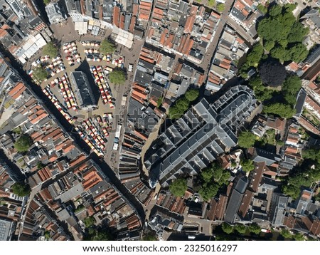 Gouda town hall, church and city center. With market taking place. Royalty-Free Stock Photo #2325016297