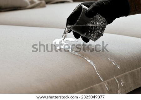 Drops of water on waterproof textile material - Waterproof fabric on upholstery Royalty-Free Stock Photo #2325049377