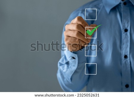 Checklist concept. Businessman checking mark on checkboxes, copy space.